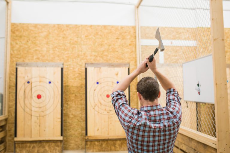 Urban axe throwing venue and participant