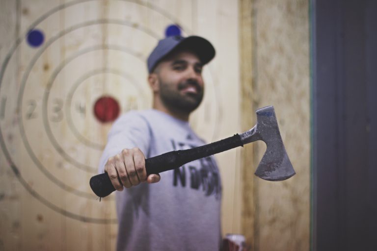 Patron holding an axe at Bad Axe Throwing Mississauga