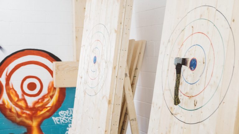 Tallying scores at axe throwing target